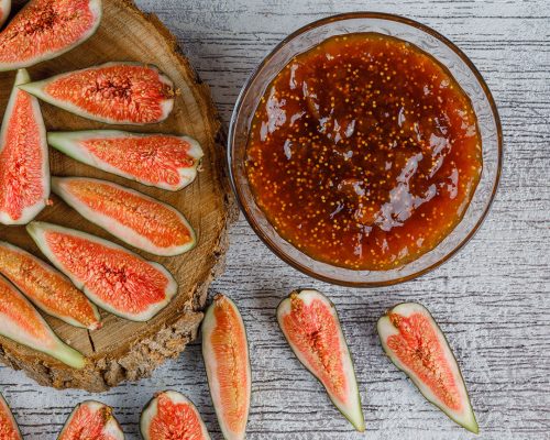 1fig-jam-with-figs-bowl-grungy-wooden-board-flat-lay